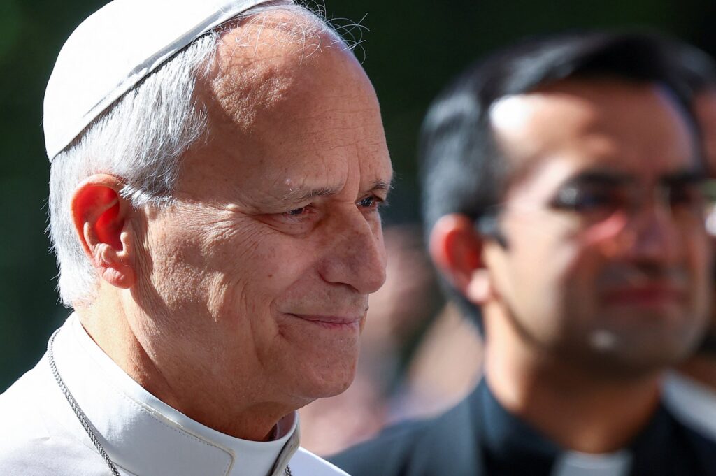 Pope Leo XIV smiles as he arrives at Rome's Gemelli Hospital on Oct. 13, 2026, ahead of his surgery that afternoon to remove a lung nodule.