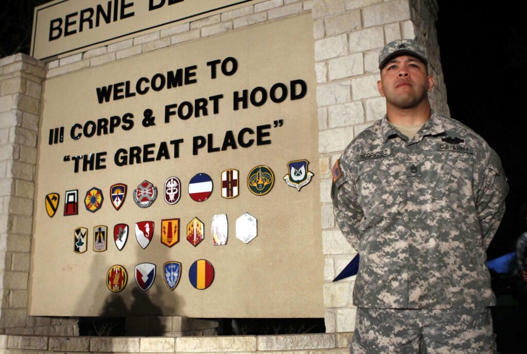 A soldier is seen in a file photo standing guard at the entrance to Fort Hood Army Post in Texas.