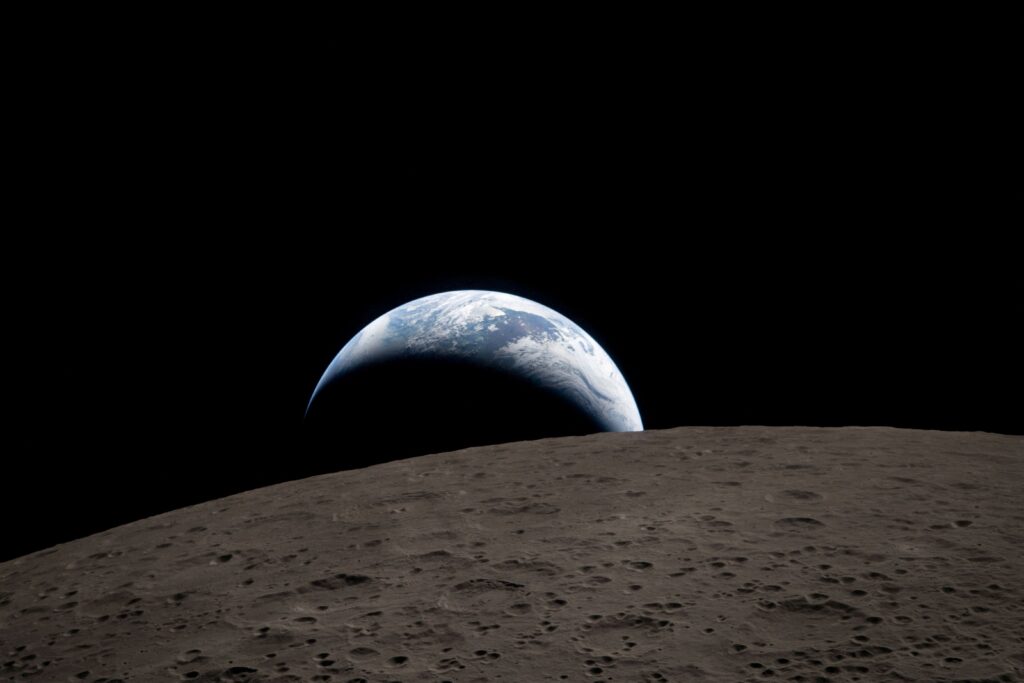 A view of Earth, partially hidden by the moon, is photographed through the Orion spacecraft window at 6:41 p.m. EDT (22:41 GMT) on April 6, 2026.