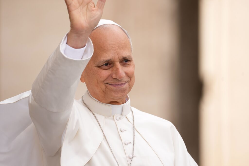 Pope Leo XIV smiles and waves from the popemobile while riding around St. Peter’s Square at the Vatican before his weekly general audience on Oct. 28, 2026.