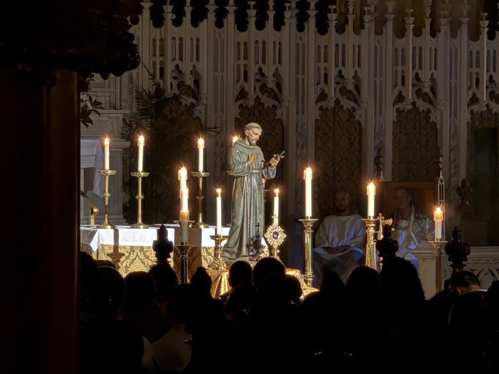 Fr. John Anthony Boughton lifts a first-class relic of St. Francis, at a vigil for the 800th anniversary of the saint’s transitus, October 3, 2026 at Our Lady of Good Counsel on East 90th St. in Manhattan.