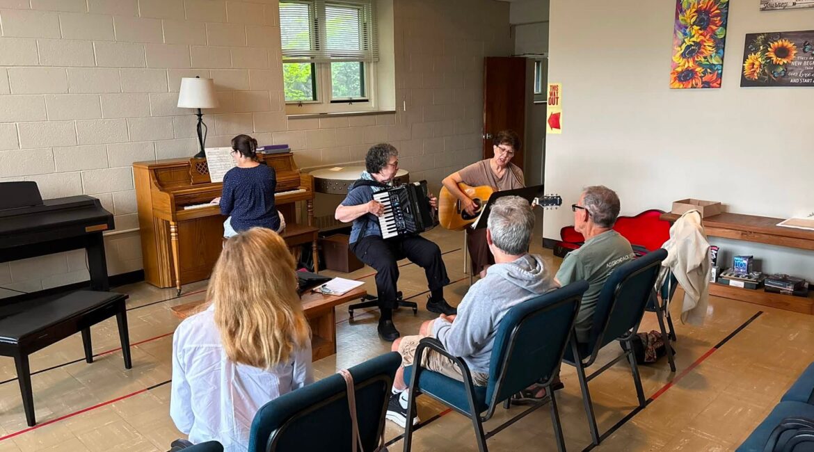 Concetta “Connie” Tomaino (left) plays the accordion, and volunteers lead sing-alongs during a session of Music and Memory at Holy Mountain at Graymoor in Garrison, September 2026.