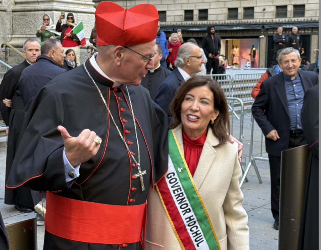 Cardinal Timothy Dolan (left) greets Gov. Kathy Hochul in front of St. Patrick’s Cathedral in Manhattan during the 82nd annual Columbus Day Parade, Oct. 12, 2026.