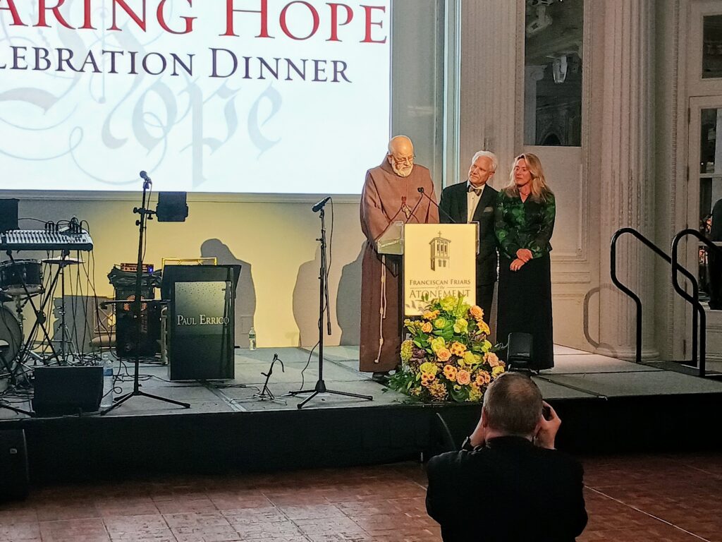 Fr. Emil Tomaskovic SA, and award recipients Allan and Louise Pashcow during the Franciscan Friars of the Atonement 33rd Annual Sharing Hope Dinner, Manhattan, Friday, Oct. 2, 2026.