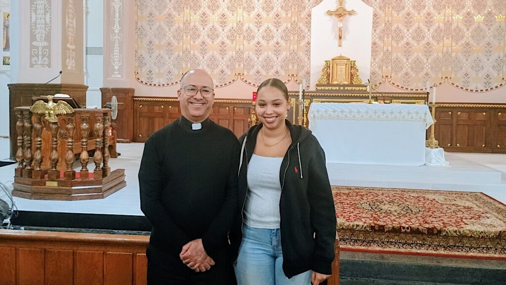Fr. Ramon Lopez and Noemi Tineo inside St. Rose of Lima Church, Manhattan, October 2026.