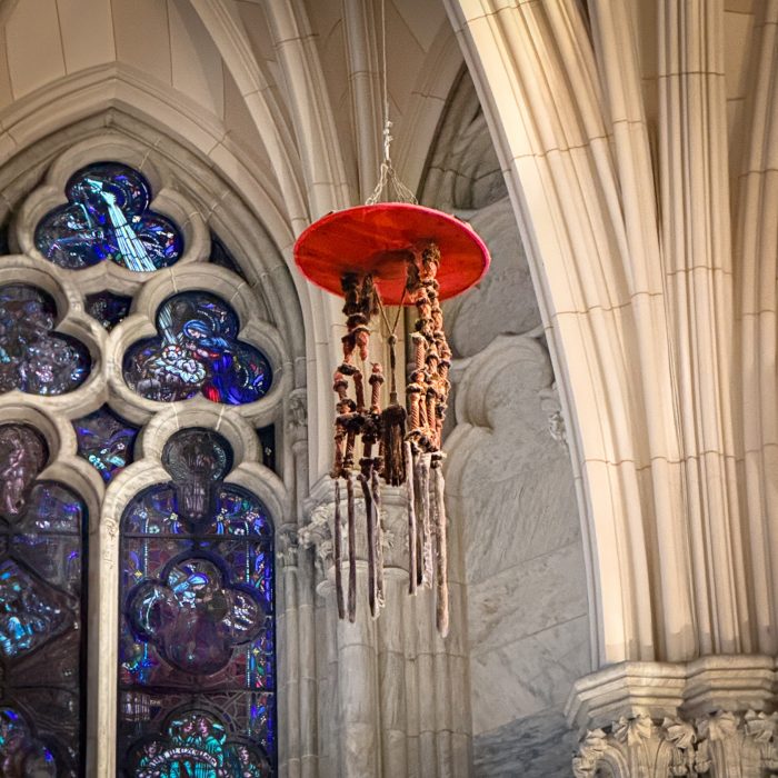 A red galero once belonging to a former Cardinal Archbishop of the Archdiocese of New York hangs near the high altar at St. Patrick’s Cathedral, a historic symbol of a cardinal’s office and authority.