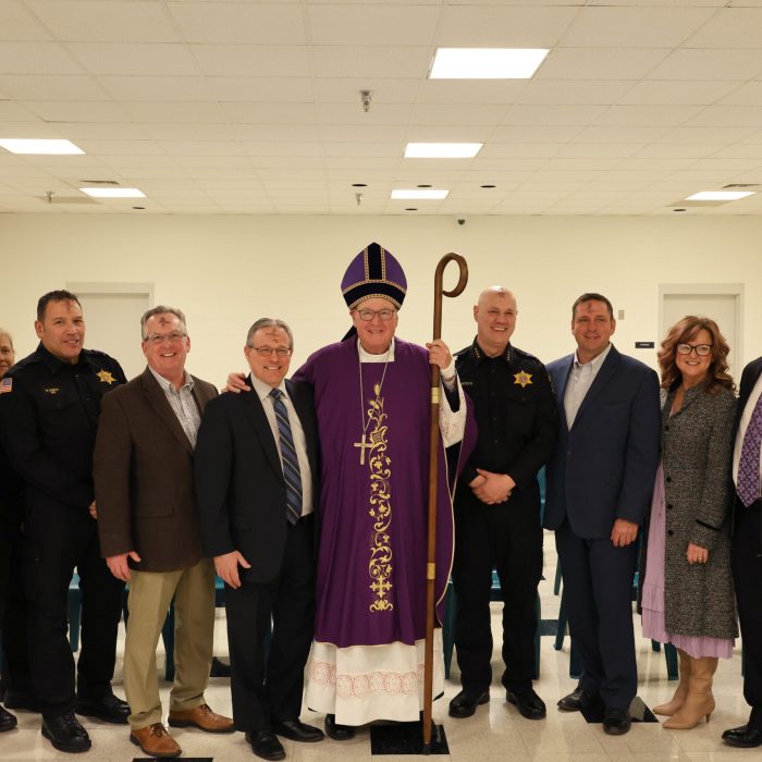 Cardinal Dolan poses with Orange County elected officials.