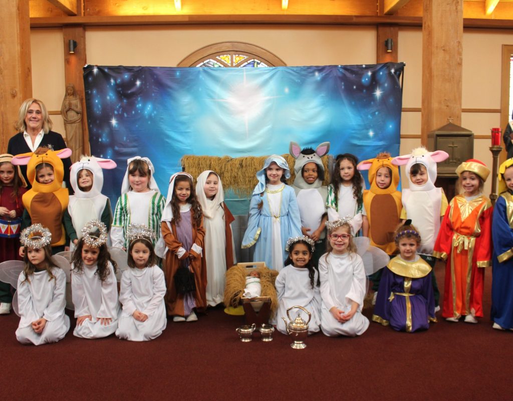The kindergarten class at Notre Dame Academy in Staten Island shares a reenactment of The Nativity, narrated by NDA President Kathryn Jaenicke, on Friday, December 19, 2025.