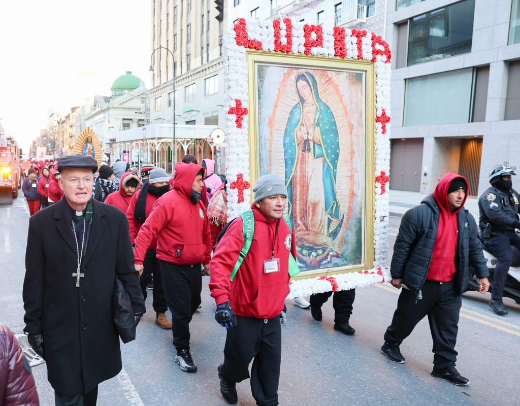 Archdiocese of New York Auxiliary Bishop Edmund Whalen (left) joins the procession from the Shrine of Our Lady of Guadalupe at St. Bernard on 14th Street through Manhattan to Saint Patrick’s Cathedral on the Feast of Our Lady of Guadalupe, December 12, 2025. Photo by Joe Vericker/Photobureau