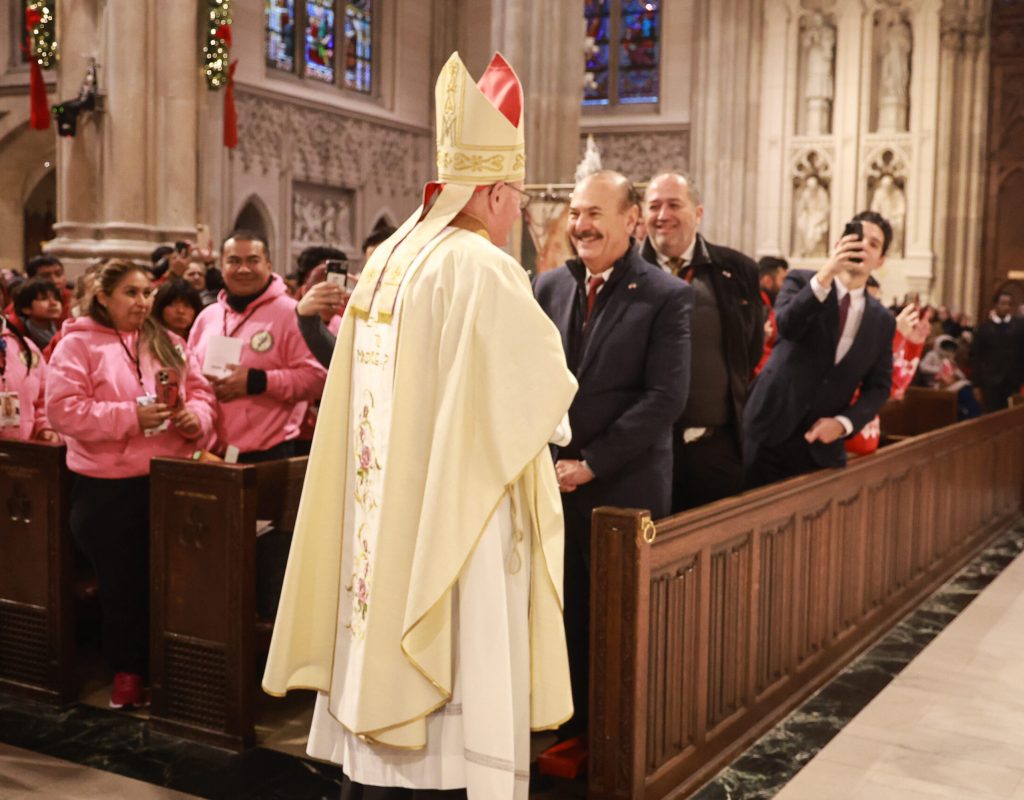 Cardinal Timothy Dolan greets Consul General of Mexico in New York Marcos Augusto Bucio Mújica during the Mass for Our Lady of Guadalupe at Saint Patrick’s Cathedral on December 12, 2025. Photo by Joe Vericker/Photobureau